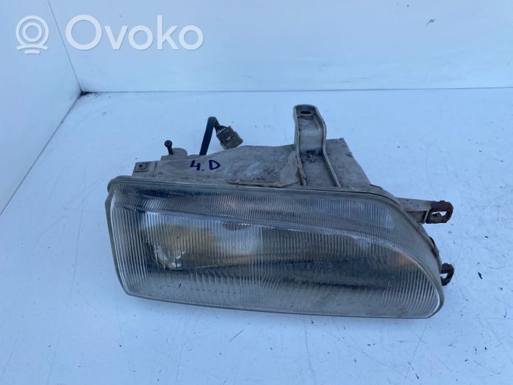 Toyota Corolla E90 Lampa przednia 12307