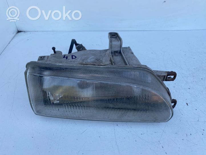 Toyota Corolla E90 Lampa przednia 12307