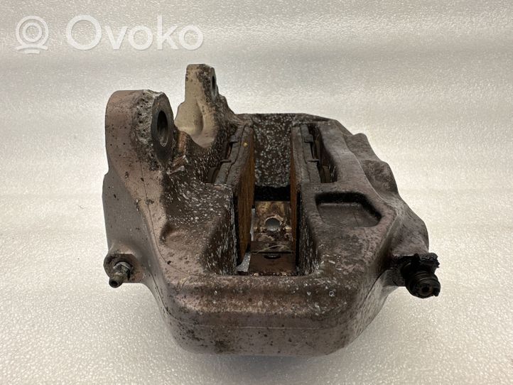 Volkswagen Touareg I Front brake caliper 209286052A