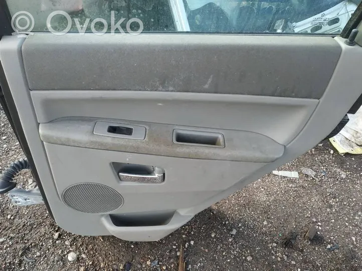 Jeep Grand Cherokee (WK) Puerta trasera pilkos