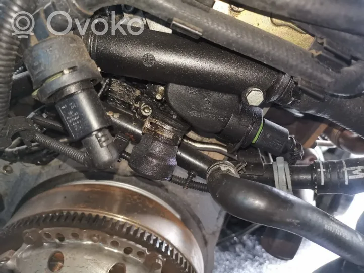 Volkswagen Lupo Tuyau de liquide de refroidissement moteur 038121133