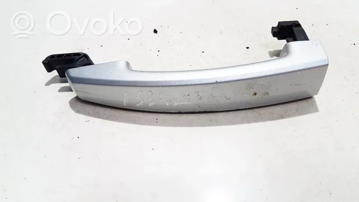 Opel Astra J Front door exterior handle 13500026