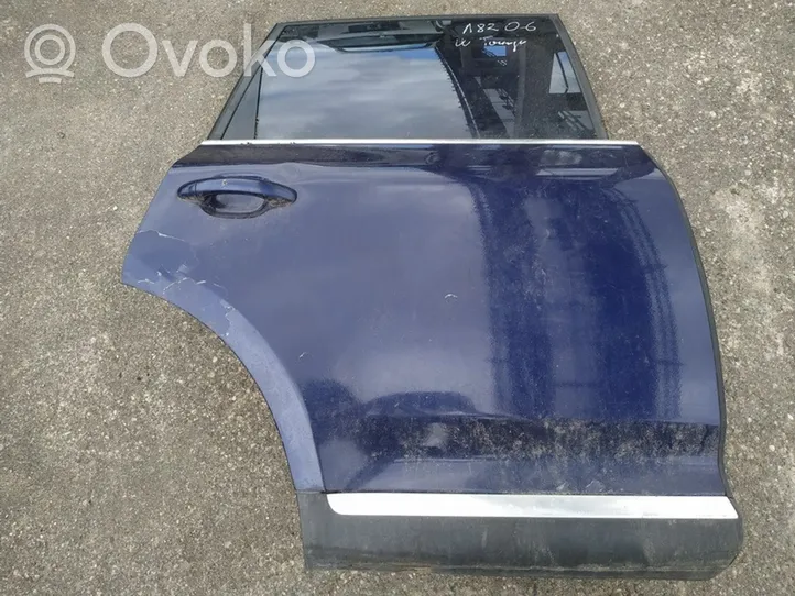 Volkswagen Touareg I Rear door melynos