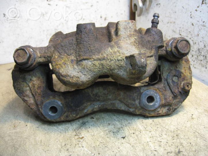 Mitsubishi Pajero Sport I Front brake caliper 