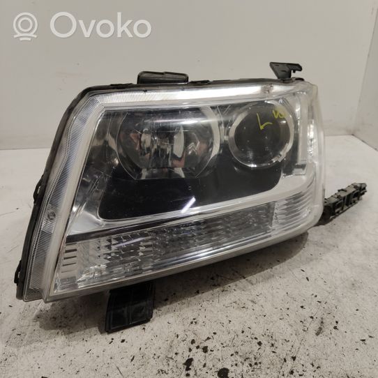 Suzuki Grand Vitara II Lampa przednia 10059088