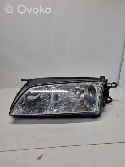 Mazda 626 Parapolvere per faro/fanale 1305239069