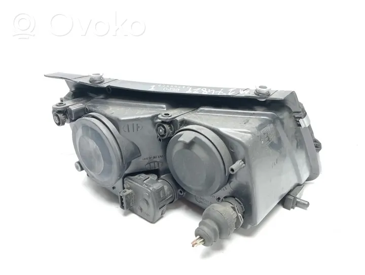 Volkswagen PASSAT B5 Lampa przednia 04765509