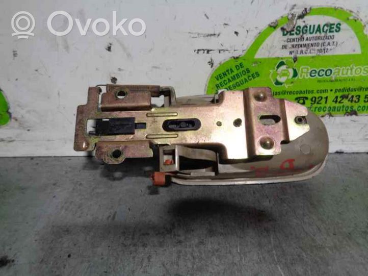 KIA Carens I Front door interior handle K9A458331