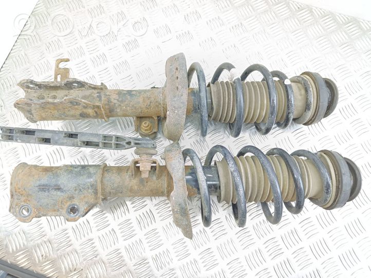 Opel Zafira C Front shock absorber with coil spring 13338920