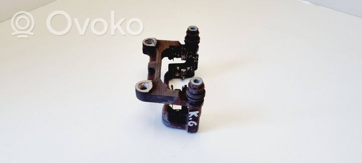 Ford Mondeo MK IV Supporto della pinza del freno posteriore 14877B