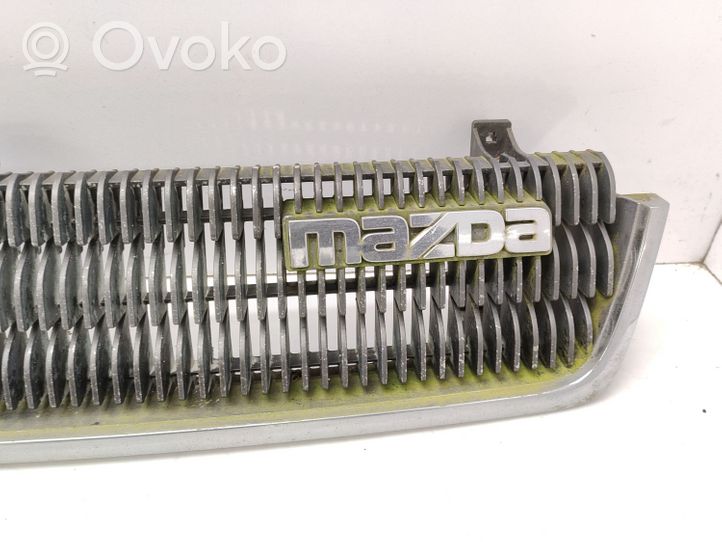 Mazda 929 Front bumper upper radiator grill HF7550710