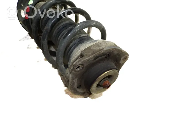 Volkswagen Caddy Front shock absorber with coil spring 1T0413031HQ