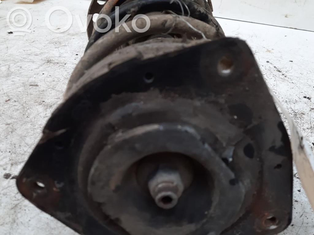 Nissan Note (E11) Amortiguador delantero con muelle espiral 