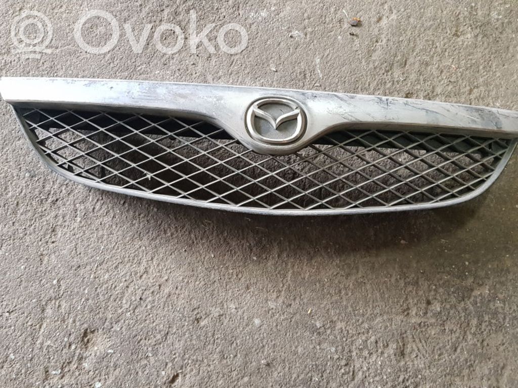 Mazda 626 Front bumper upper radiator grill 