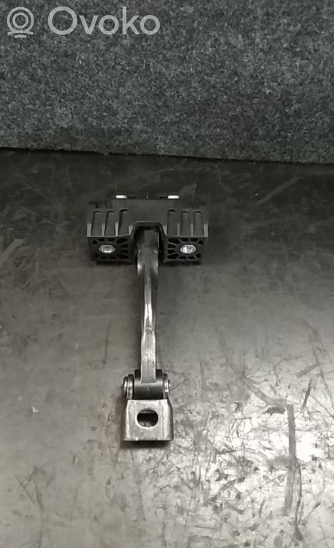 Front door check strap stopper   7070333