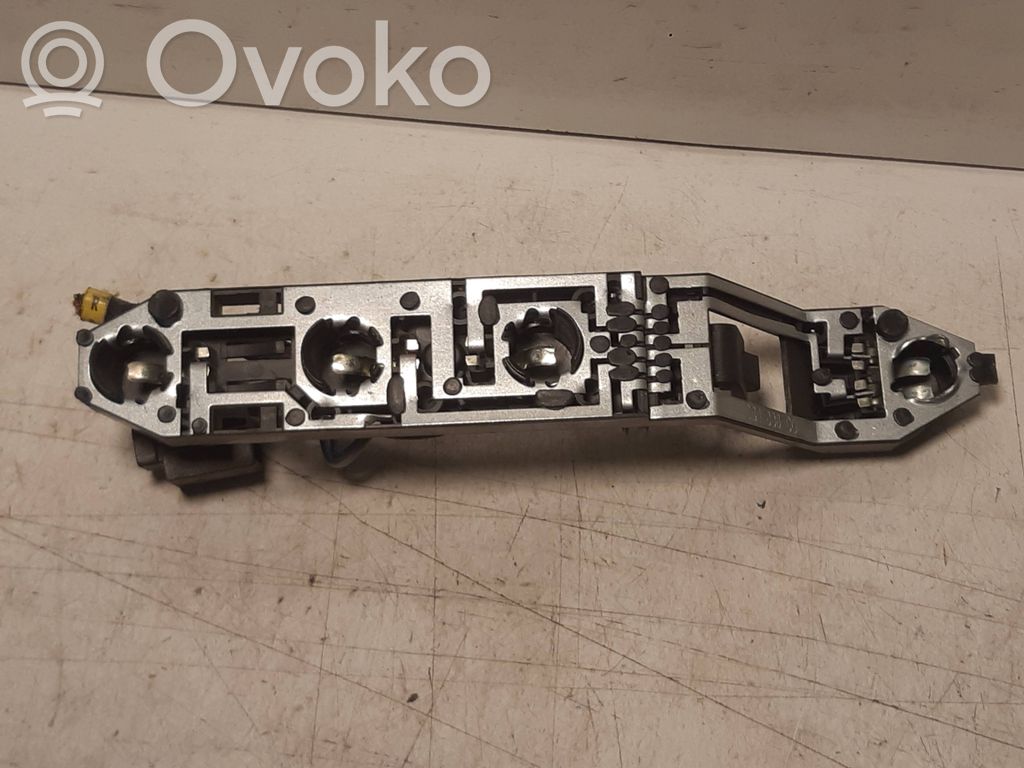 Renault Megane II Takavalon polttimon suojan pidike 