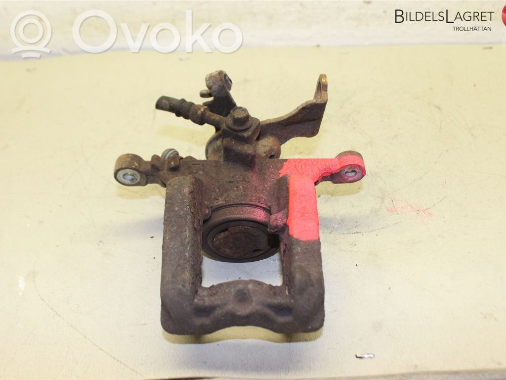 Opel Astra J Tylny zacisk hamulcowy 