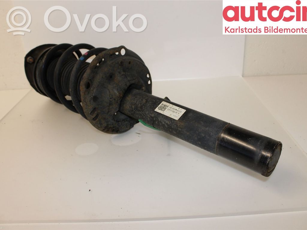 Volkswagen Golf VII Amortyzator osi przedniej ze sprężyną 
