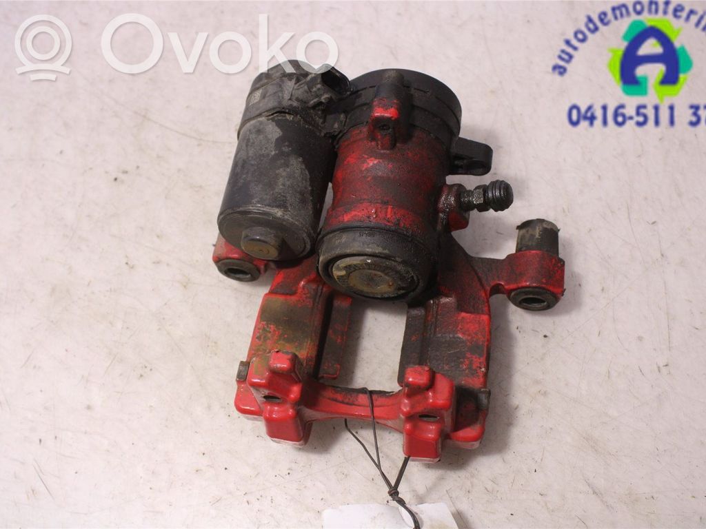 Ford Mondeo MK V Tylny zacisk hamulcowy 