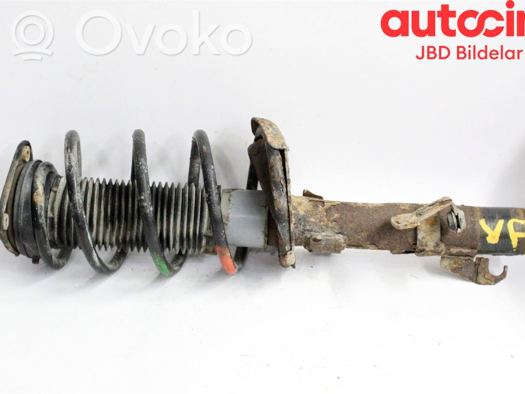 Front shock absorber with coil spring