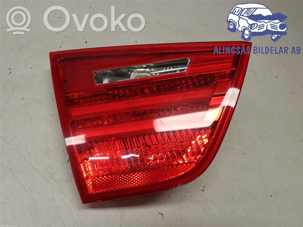 BMW 3 E90 E91 Aizmugurējais lukturis pārsegā 