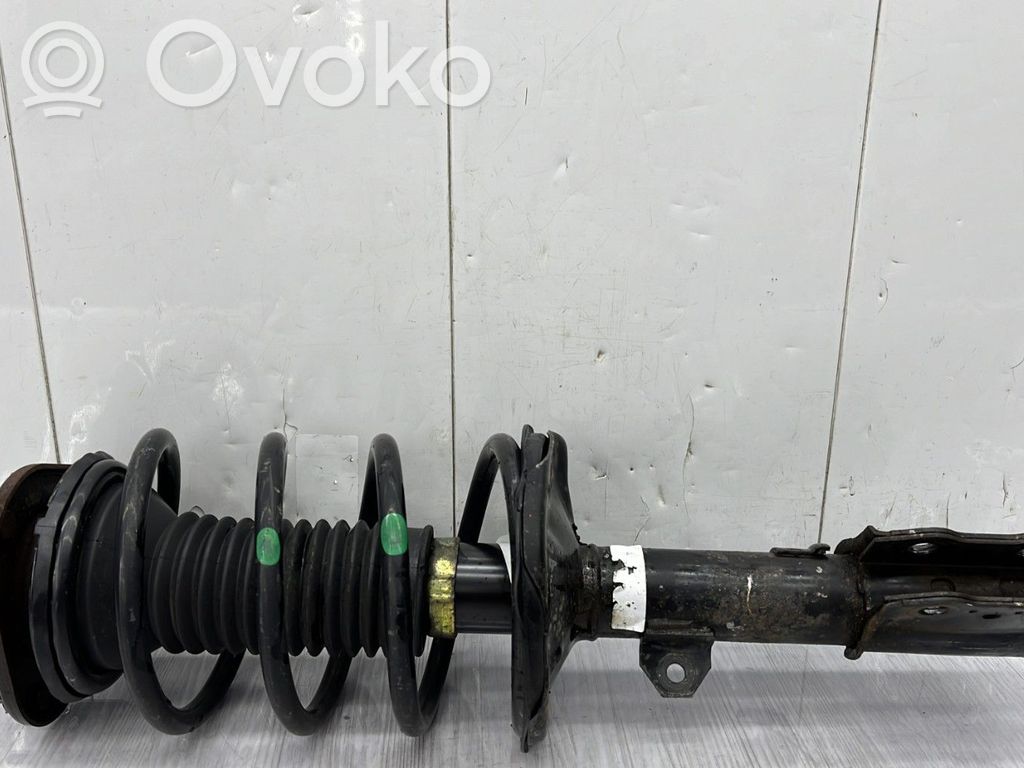 Toyota Corolla E120 E130 Priekinis amortizatorius su spyruokle 