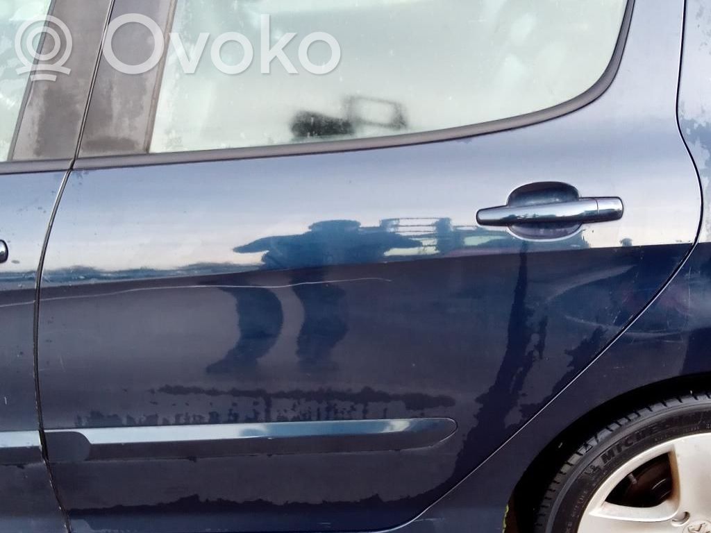 Peugeot 308 Szyba drzwi tylnych 