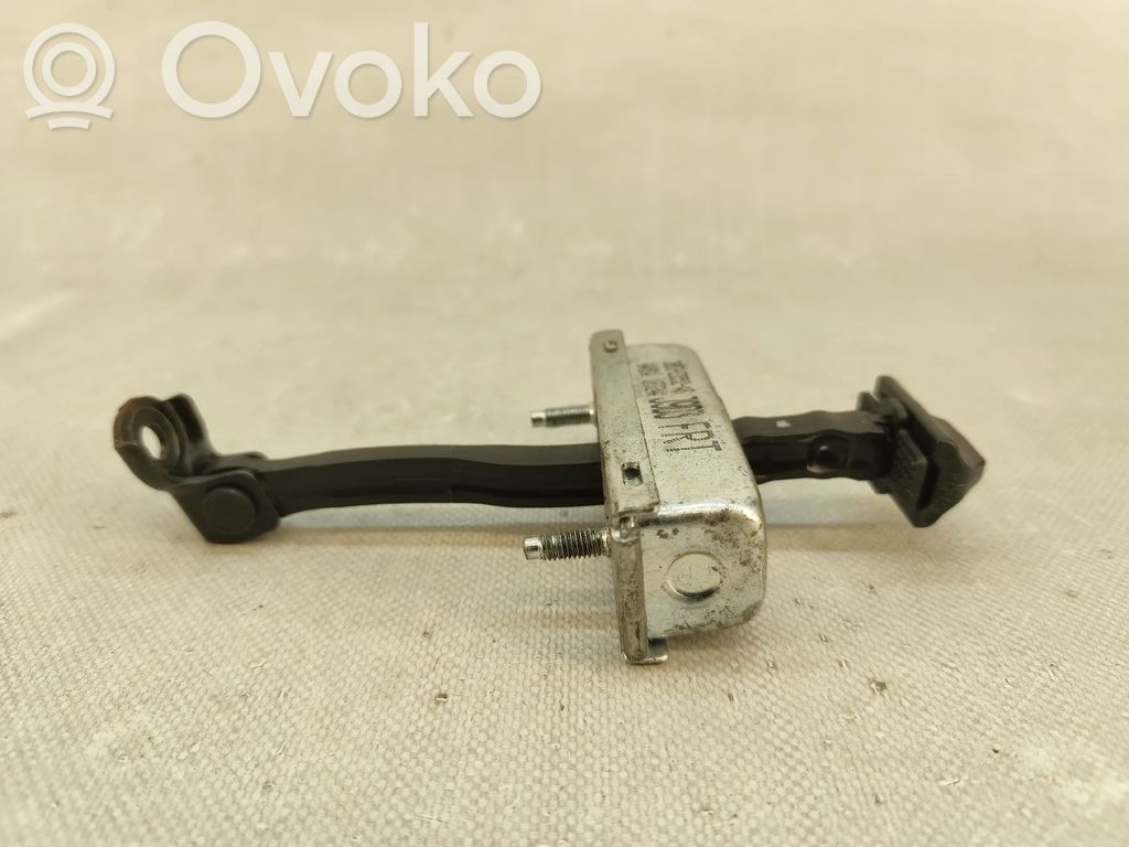 Front door check strap stopper   J9D323552AB