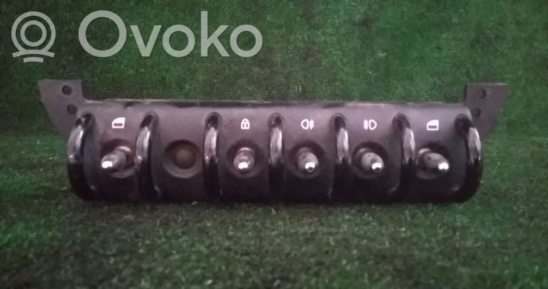 Multifunctional control switch/knob   37057B,6917985,BOTAOVIDROSTRANCA,DESTRANCA