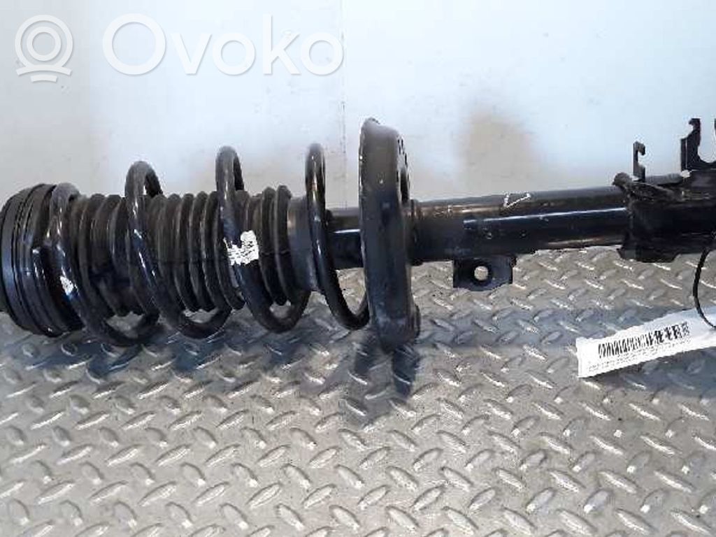 Opel Corsa D Amortyzator osi przedniej ze sprężyną 