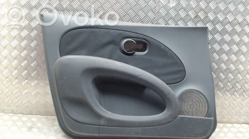 Nissan Micra C+C Garniture de panneau carte de porte avant