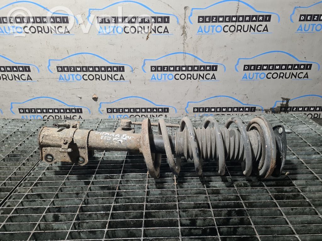 Suzuki Grand Vitara II Front shock absorber with coil spring 