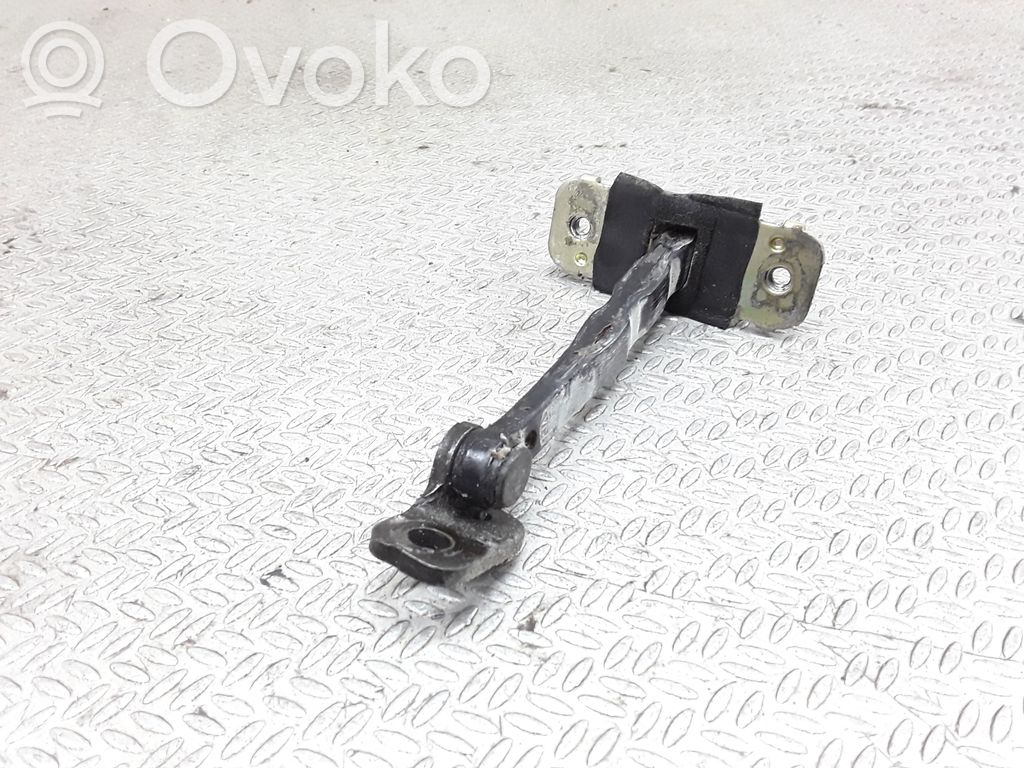 Front door check strap stopper