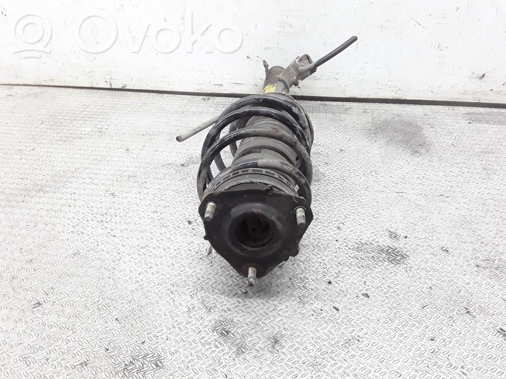 Front shock absorber with coil spring