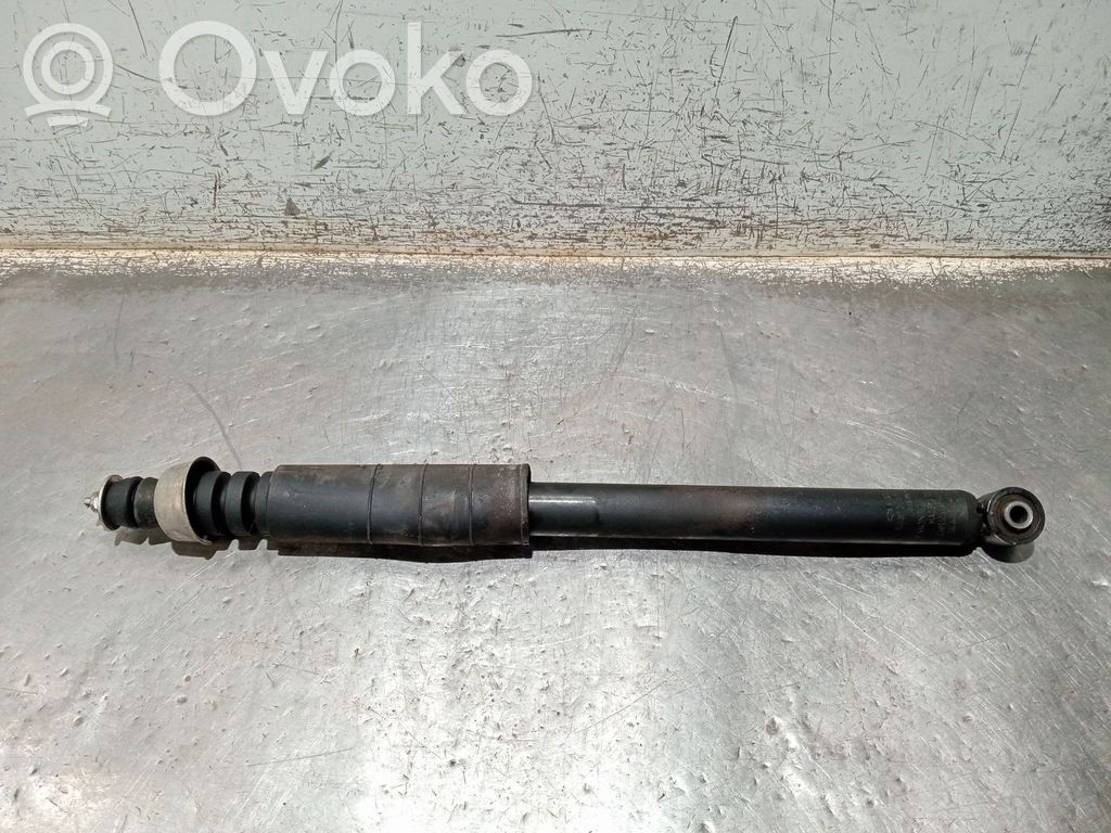 Nissan Note (E11) Aizmugurē amortizators 
