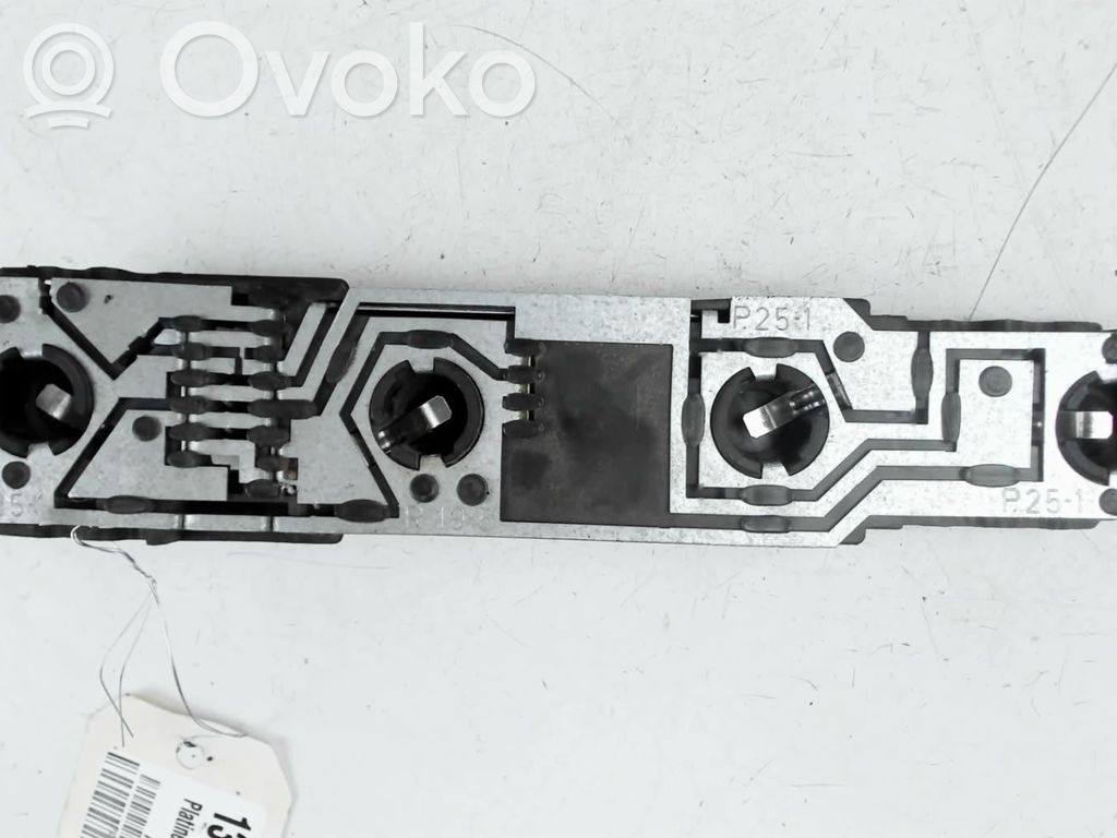 Tail light bulb cover holder