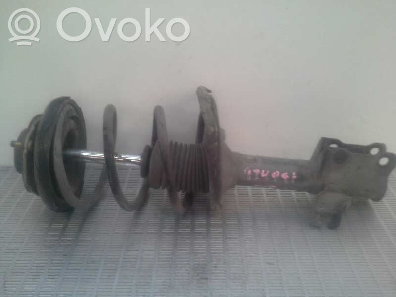 Nissan Almera N16 Etuiskunvaimennin kierrejousella