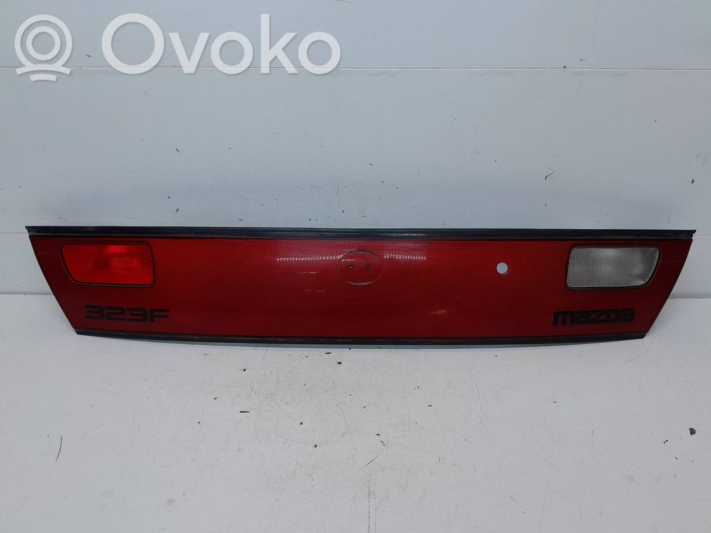 Mazda 323 F Trunk door license plate light bar 