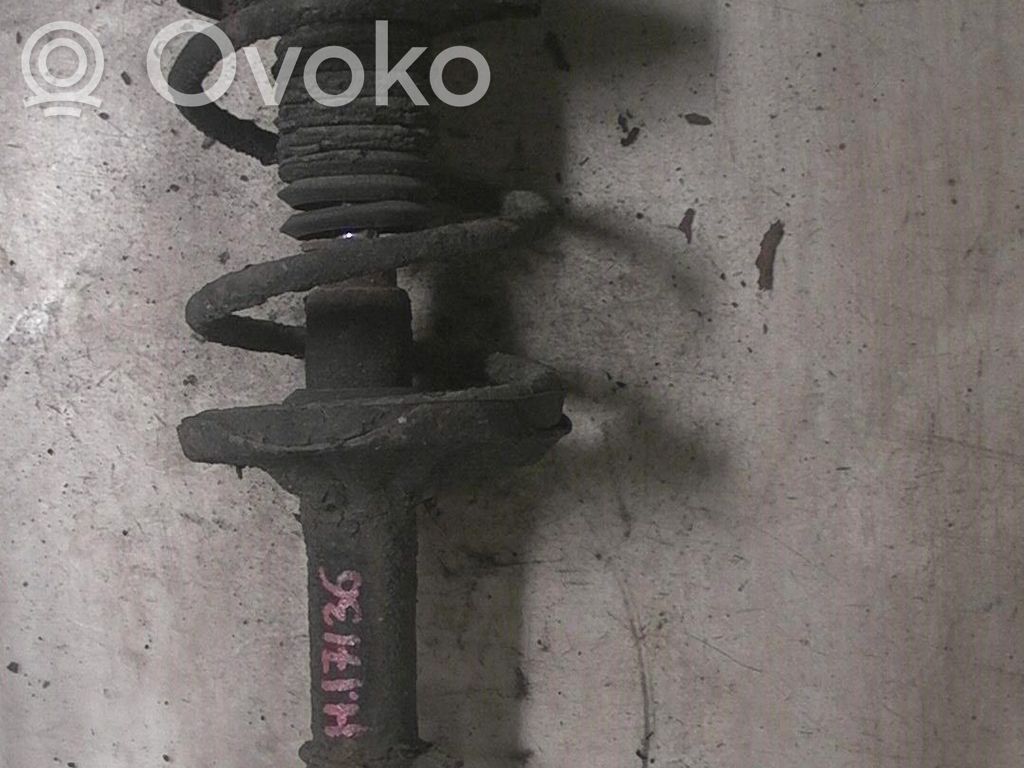 Front shock absorber with coil spring