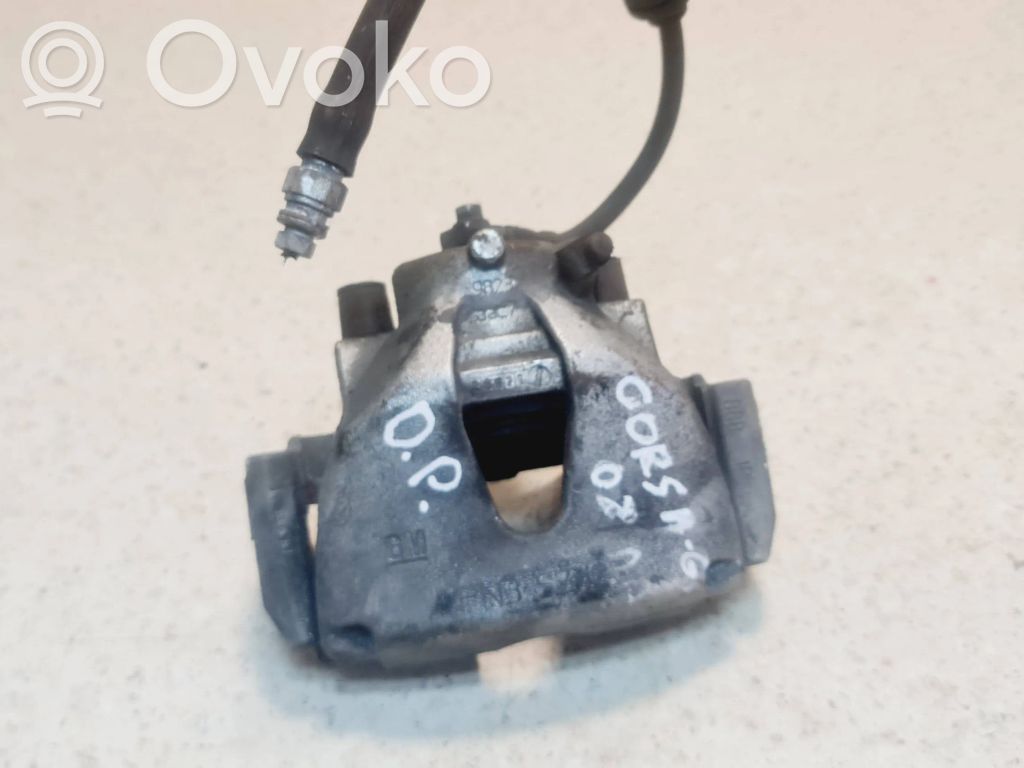 Opel Corsa D Zacisk hamulcowy przedni 