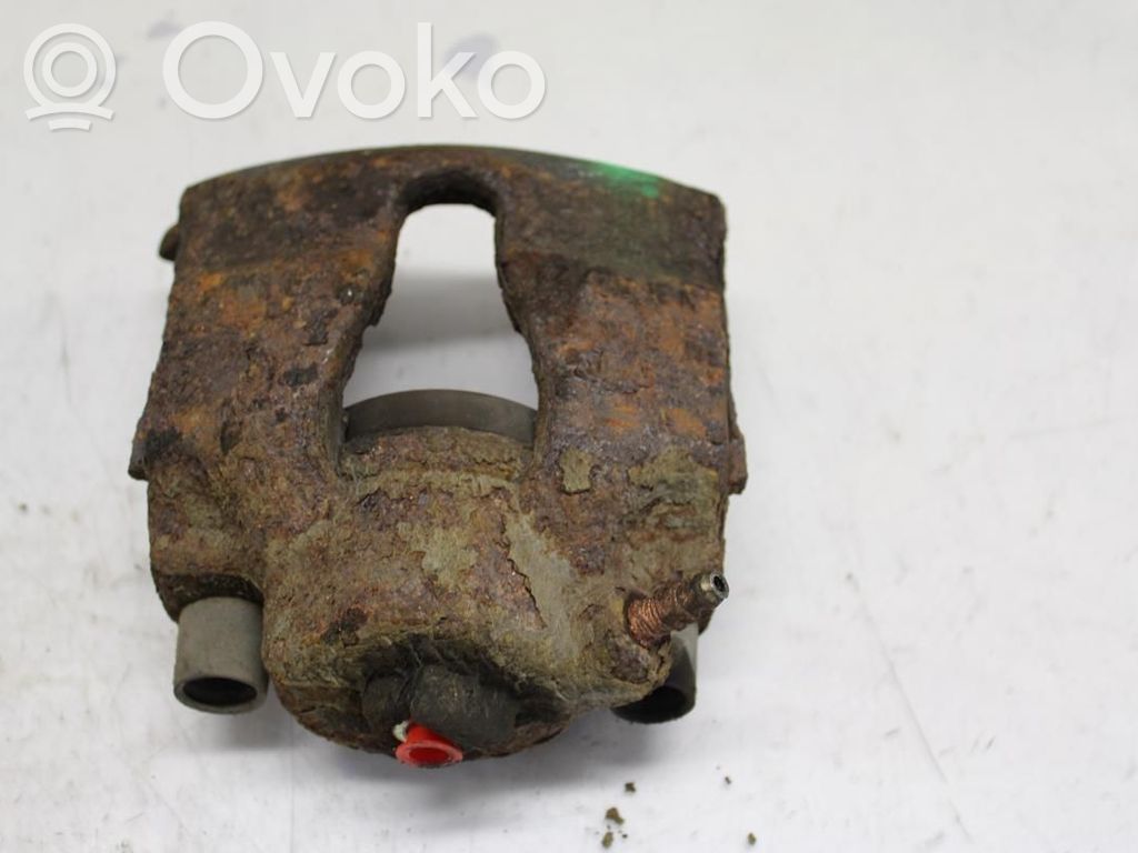 Opel Astra G Zacisk hamulcowy przedni 