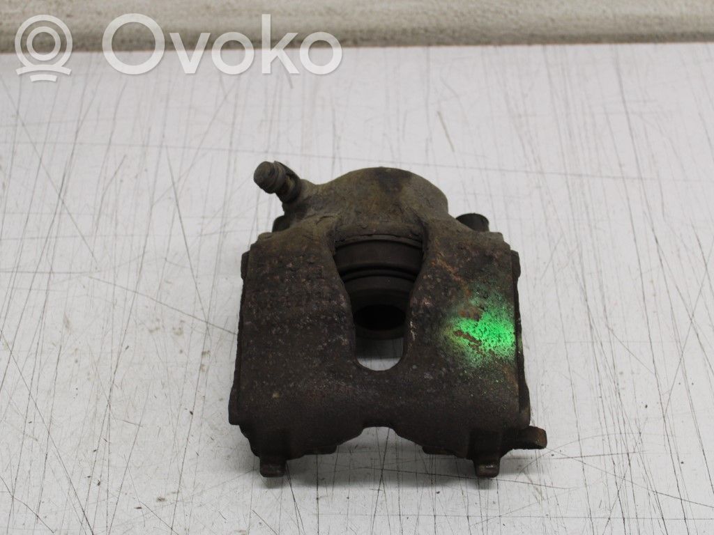 Opel Astra G Zacisk hamulcowy przedni 