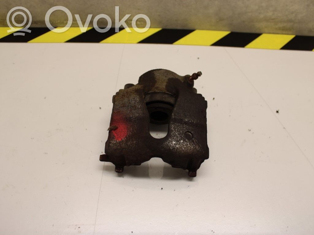 Opel Astra G Zacisk hamulcowy przedni 