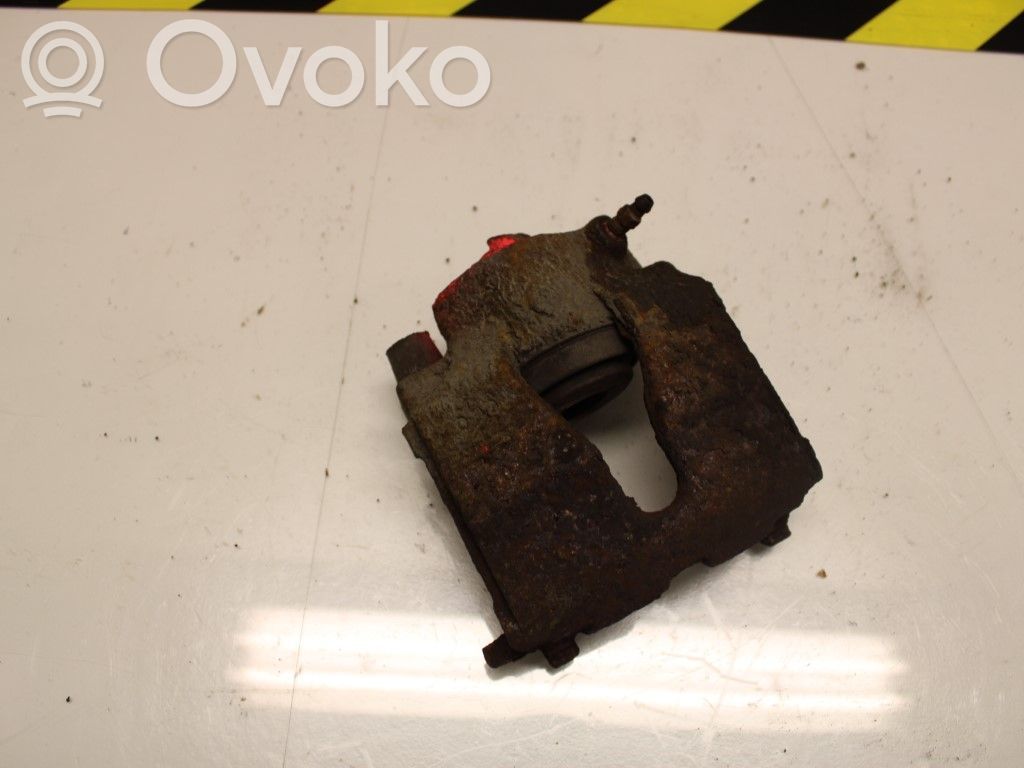 Opel Astra G Zacisk hamulcowy przedni 
