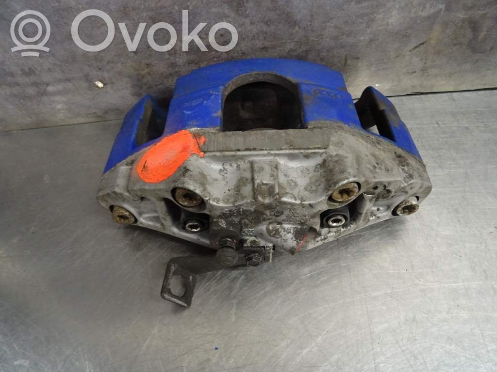 Volkswagen Golf V Zacisk hamulcowy przedni 