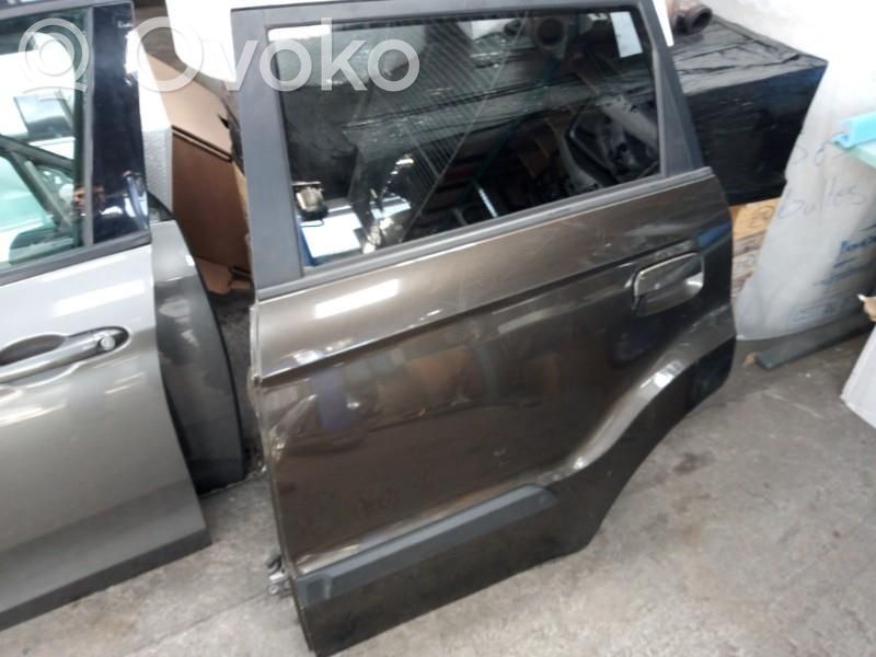 Puerta trasera   770032K010