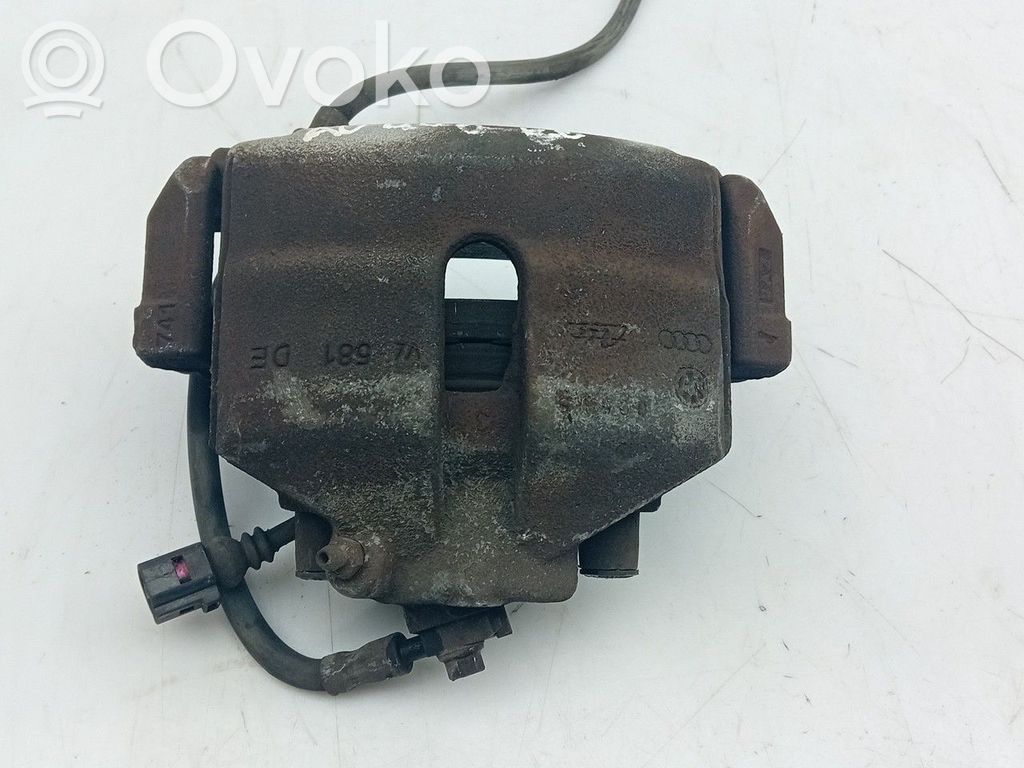 Volkswagen PASSAT B6 Zacisk hamulcowy przedni 