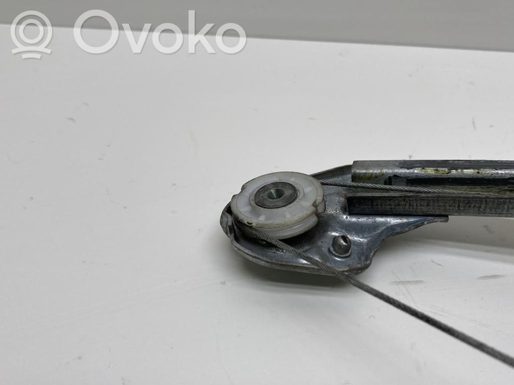 Opel Corsa C Regulador manual de la ventanilla trasera 