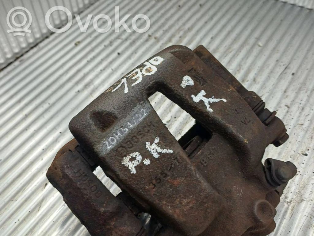 Opel Corsa D Zacisk hamulcowy przedni 