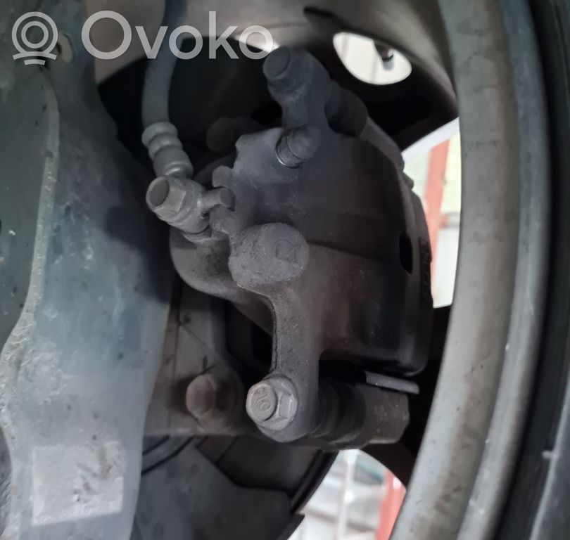 Mazda CX-7 Jarrusatulan tyynyn pidike takana 
